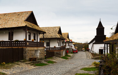 Illustration of view on the streets of traditional hungarian village Holloke outdoor.