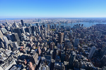 View of Manhattan from Empire State Building Observatory in New York on clear autumn day.