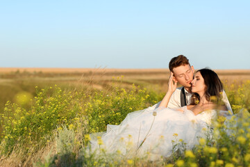 Happy wedding couple in countryside