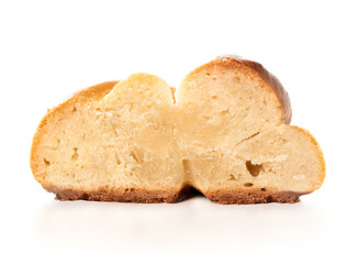 Baked yeast bread slice with undercooked and raw dough. Cross-section of white bread called zopf or challah. Concept for danger of eating raw dough, baking problems or stove broken. Isolated on white.