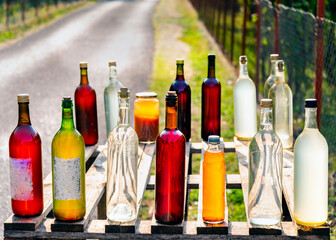 Homemade honey and wine for sale on the roadside,in the morning sun, near lake Skadar,Montenegro.