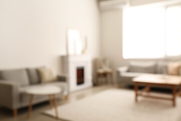 Stylish interior of living room, blurred view