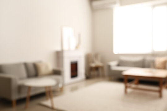 Stylish interior of living room, blurred view