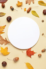 Naklejka na ściany i meble Blank card, autumn leaves, acorns and chestnuts on color background, closeup