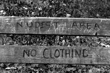 no clothing sign on a bench 