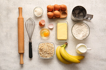 Fresh ingredients for preparing homemade cookies on light background