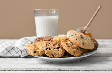 Plate with tasty homemade cookies on table