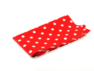 White polka dot on red fabric or napkin isolated on white background. Concept kitchen utensils and tableware..