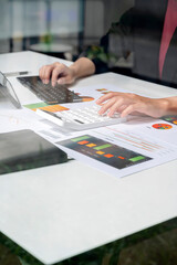 woman hand using calculator, calculating graph and chart.
