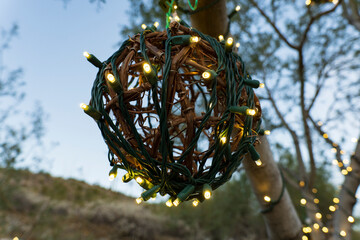 christmas tree ornament lit with christmas lights