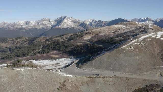 Aerial 4K Drone footage of a high mountain pass with fresh snow in the colorado Rocky Mountains called Cottonwood pass.
