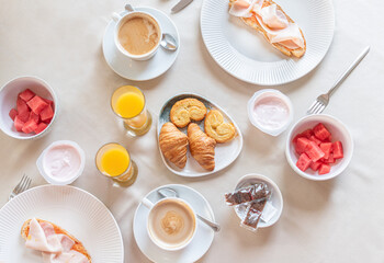Top view of a full breakfast at a table.
