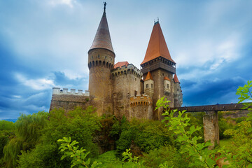 Fototapeta na wymiar Corvin Castle is on the green mountain of Romania.