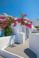 Amazing Santorini landscape with white architecture and sea view. Sunny summer travel background, cityscape, urban scenic. Idyllic streets, pathway, pool and houses. Luxury resort hotel vacation