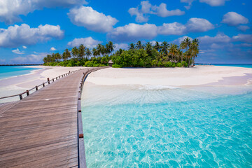 Calm meditational ocean lagoon with blue sunny sky. Idyllic scenic, palm trees long wooden jetty into paradise island, luxury travel destination. Inspirational scenic view, Maldives freedom vacation