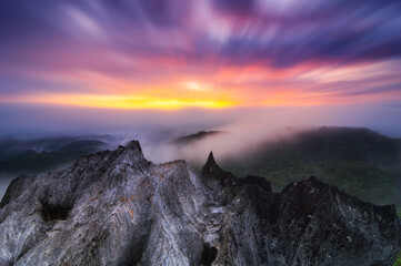 Beautiful morning sunrise over the sea of mist and rocky mountains. pang puai, Mae Moh, Lampang, Thailand.