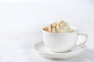 Drink in a white mug with cream