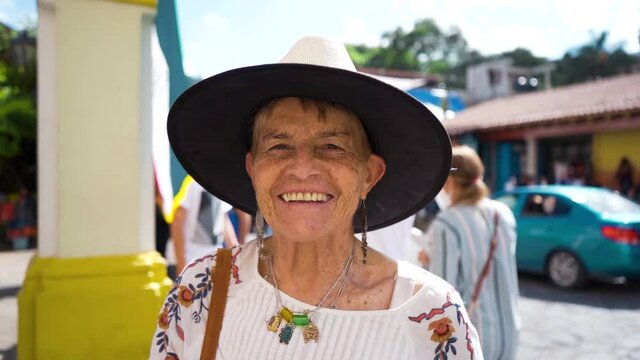 senior latin woman looking at camera