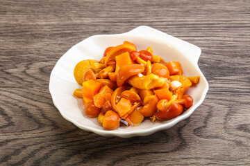 Marinated pickled honey mushrooms in the bowl