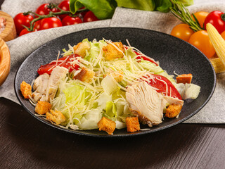 Caesar salad with chicken and cheese
