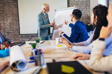Speaker at business workshop and presentation. Audience at the conference room.