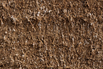 Pulled cotton packed in a field waiting to be loaded