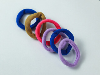 colorful hair band pink, blue,purple and brown on white background