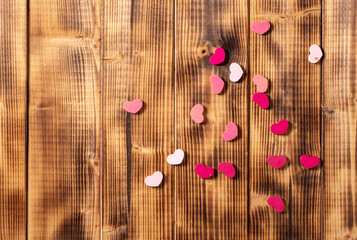 Red and pink hearts on a wooden