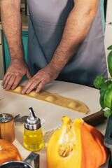 Staying at home and cooking. Homemade Italian pumpkin ricotta ravioli, ravioli molding process.