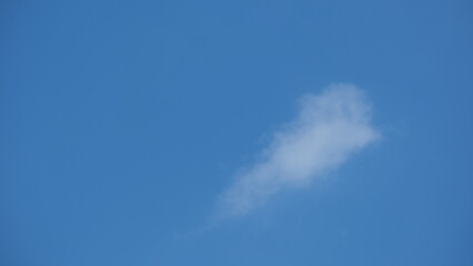 View of beautiful blue sky background with white clouds at the noon, Bangkok, Thailand.