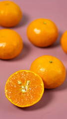 orange fruit on a pink background
