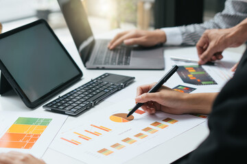 two young businessmen discussing project at meeting