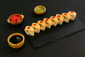 Grilled Philadelphia roll sushi with salmon, prawn, avocado, cream cheese. Sushi menu. Japanese food.