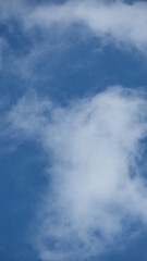 View of beautiful blue sky background with white clouds at the noon, Bangkok, Thailand.