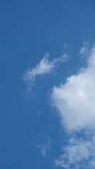 View of beautiful blue sky background with white clouds at the noon, Bangkok, Thailand.