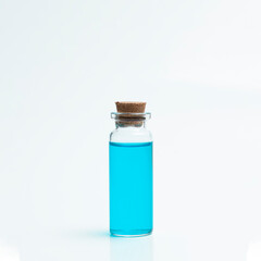 Bottle with blue liquid on a white background.