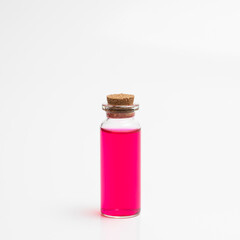 Flask with red liquid on white background