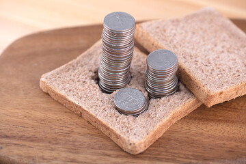 Coins on bread symbolize rising prices