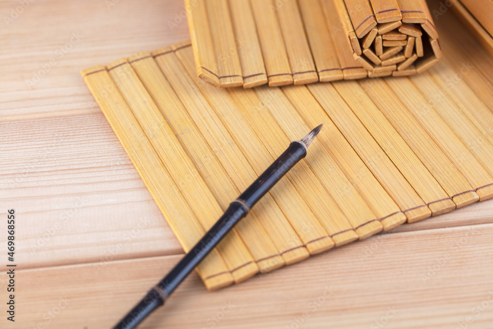 Sticker bamboo slips and writing brush on the table