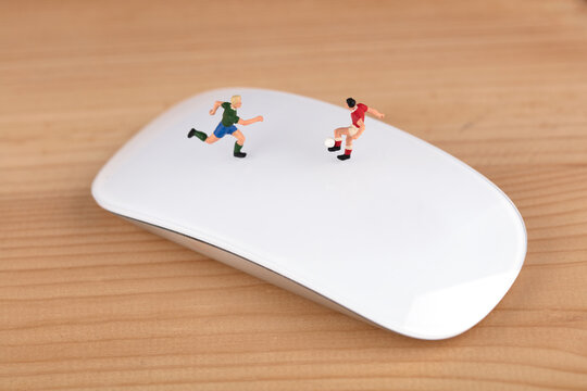 Athlete kicking football on mouse