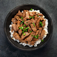 Bulgogi with meat on dark background.