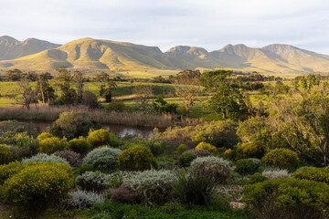 View across a tranquil landscape, river valley and a mountain range
