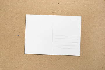 Empty postcard on cardboard