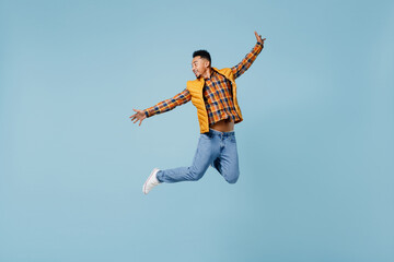 Full size body length overjoyed excited jubilant fun young black man 20s years old wear yellow...