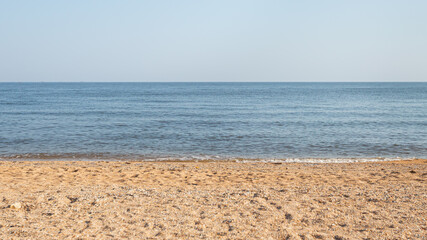 Sea line. Calm Azov sea and clear blue sky. The concept of calm and silence. 