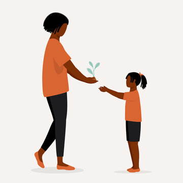 Environmental Conservation Concept. Black Adult Woman Passing The Plant To The Little Girl Educating The Younger Generation About The Climate Change And Global Warming.