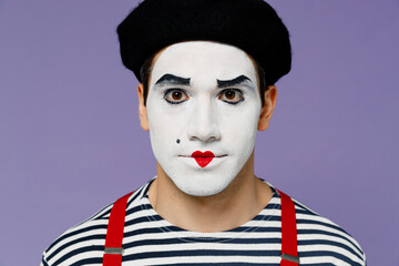Fototapeta na wymiar Close up amazing charismatic marvelous magnificent vivid young mime man with white face mask wears striped shirt beret looking camera isolated on plain pastel light violet background studio portrait.