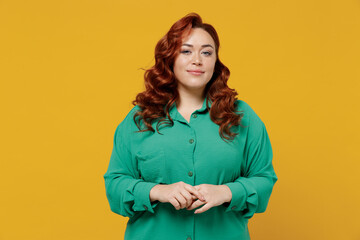 Charming bright happy young ginger chubby overweight woman 20s years old wear green shirt looking...