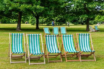 Deck chairs in park. London, UK