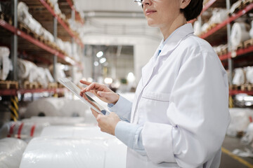 Using tablet at polymer factory storage